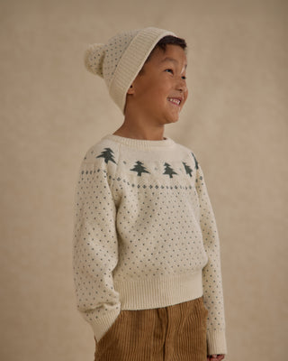 Rylee & Cru Fairisle Sweater - Trees
Child wearing a cream sweater with tree pattern and beige knit hat on a beige background