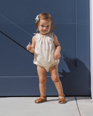 Rylee & Cru sailor-themed shoulder tie bubble romper with large bow detail, for infants, in a playful, casual setting.