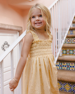 Rylee & Cru Hanna Lemon Dress for girls, featuring a bright yellow print and soft fabric, displayed on a child model.
