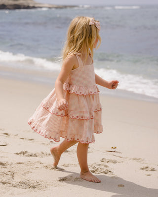 Rylee & Cru petal gingham ruffled swing dress on a child, featuring playful ruffles and a classic gingham pattern.