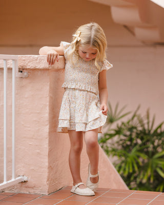 Rylee & Cru summer floral tiered mini skirt displayed on a model, featuring a breezy, layered design perfect for warm weather.