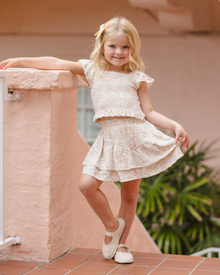 Rylee & Cru summer floral tiered mini skirt displayed on a model, showcasing lightweight fabric and vibrant floral pattern.