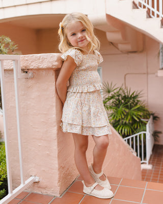 Rylee & Cru tiered mini skirt in summer floral print, showcasing lightweight fabric and stylish tiered design.