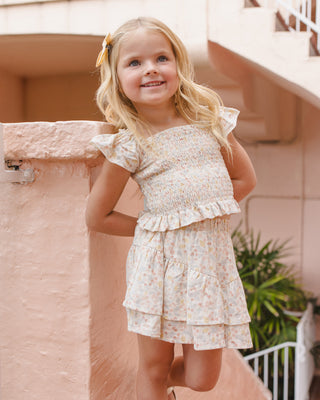 Rylee & Cru Zayla Top in Summer Garden print, a stylish shirt with floral design, modeled by Lindsay Arnold.