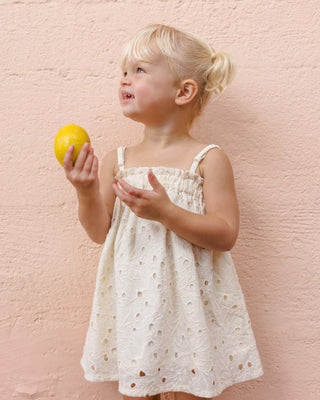 Rylee & Cru Sahara Mini Dress in ivory, styled on a model, showcasing the lightweight, casual dress design perfect for warm weather.