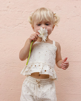 Rylee & Cru Kayli Ivory 2-piece outfit for kids, featuring a soft top and matching bottoms, styled in a lifestyle setting.