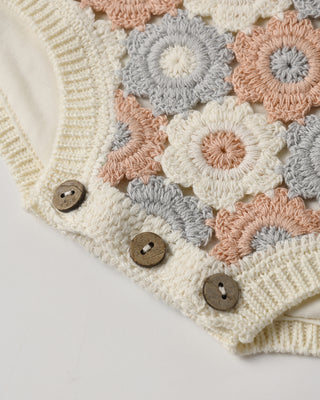 Rylee & Cru crochet romper in ivory with light pink and blue accents, featuring a soft, textured knit design for babies.
