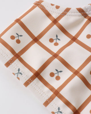 Rylee & Cru Rouched Bikini - Cherry Check
Fabric with brown diamond pattern and cherry designs on a white background