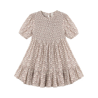 Rylee & Cru India Dress - Primrose
A short-sleeve babydoll dress with a smocked bodice and a tiered ruffle hem, featuring a delicate beige and brown floral pattern, shown on a plain white background.