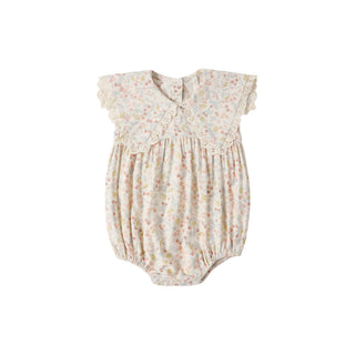 Rylee & Cru Porter Romper in Summer Garden print, ivory color, lightweight fabric, featuring short sleeves and floral design.