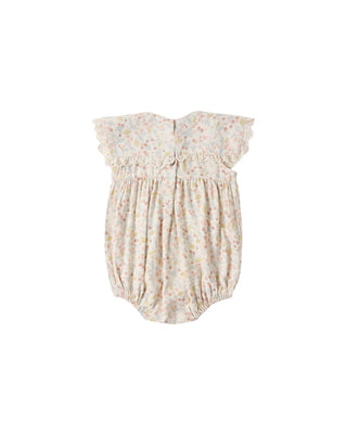 Rylee & Cru Porter Romper in Summer Garden print, ivory color, lightweight fabric, featuring sleeveless design and floral pattern.