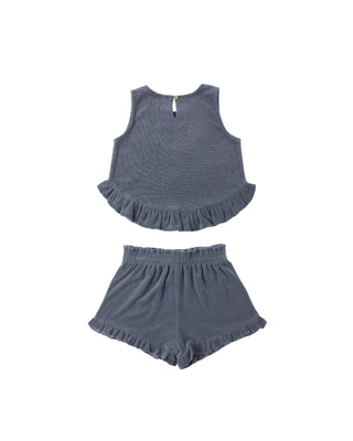 Rylee & Cru Faye Set - Marine
Children's blue ruffled top and shorts set on a white background