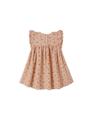 Rylee & Cru Kinsley Dress in melon color, soft cotton fabric, featuring a playful, sleeveless design perfect for girls.