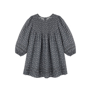 Rylee & Cru Selene Dress - Heart Ditsy
A dark gray long-sleeve blouse with a small white floral pattern, featuring a smocked bodice and gathered sleeves, shown against a plain white background.