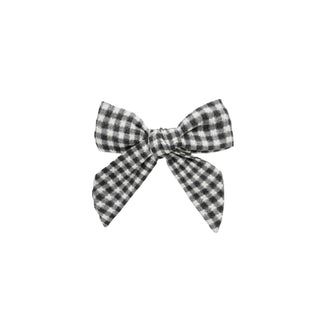 Rylee & Cru Bow - Black Gingham
Black and white checkered bow on a white background
