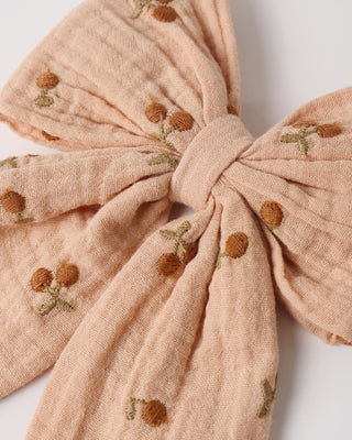 Rylee & Cru Oversized Bow - Cherry Embroidery
Pink fabric bow with embroidered brown flowers on a white background