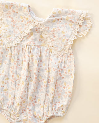 Rylee & Cru Porter Romper in Summer Garden print, featuring lightweight fabric, short sleeves, and a relaxed fit for warm weather.