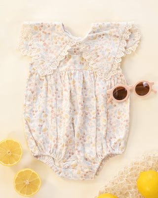 Rylee & Cru Porter Romper in Summer Garden print, featuring a lightweight, sleeveless design with floral patterns and a relaxed fit.