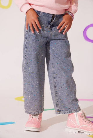Lola and The Boys Rainbow Sparkle Jeans
Person wearing blue jeans and pink shoes on a light gray background