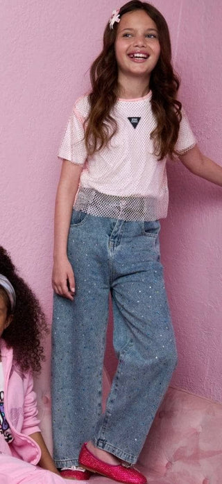 Lola and The Boys Rainbow Sparkle Jeans
Girl wearing a white t-shirt with a logo and blue jeans on a pink background