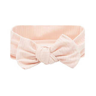 Lou Lou and Company Ribbed Headband - Rosie
Pink headband with a bow on a white background
