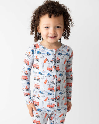 Lev Baby Poppy Convertible Zipper Romper - Ryan
Child wearing pajamas with vehicle pattern on a white background