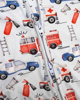 Lev Baby Poppy Convertible Zipper Romper - Ryan
Zipped fabric with emergency vehicle pattern including fire trucks, ambulances, and police cars.