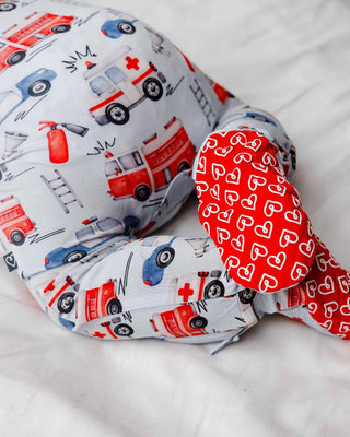 Lev Baby Zippered Footie - Ryan
U-shaped pillow with fire truck and ambulance pattern on a white background