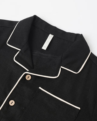 Black Rylee & Cru lapel collar shirt shown on a model, featuring a classic collar and tailored fit for casual or semi-formal wear.