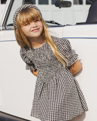 Black check Rylee & Cru Louise dress for girls, featuring a classic check pattern and comfortable fit.