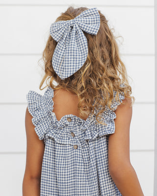 Rylee & Cru Oversized Bow - Marine Gingham
Rylee & Cru Lennon Dress - Marine Gingham
Child wearing a blue and white checkered dress with a large bow in their hair against a white background