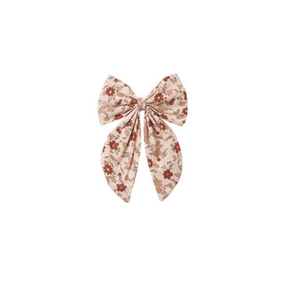 Rylee & Cru Oversized Bow - Pink Floral
A small airplane flying in the sky with a clear background