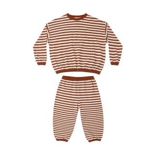 Rylee & Cru Relaxed Set - Brick Stripe
A two-piece children's pajama set featuring a long-sleeve top and matching pants, both with horizontal rust-brown and cream stripes.