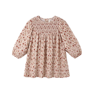 Rylee & Cru Selene Dress - Pink Floral
A long-sleeve babydoll dress for toddlers, featuring a smocked bodice and an all-over small floral print in muted red and brown on a warm beige background.