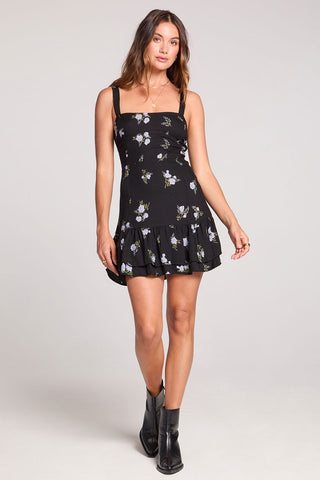 Black Saltwater Luxe Carleigh Mini Dress displayed on a hanger with a fitted silhouette and stylish design.