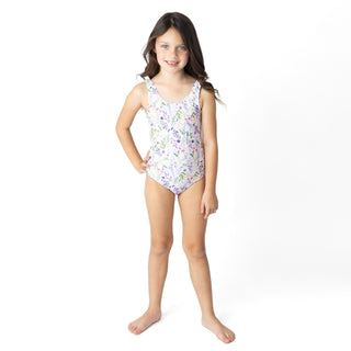 Shade Critters Fringe Back One Piece Swimsuit - Wildflower Fields
Young girl wearing a floral swimsuit on a white background