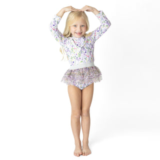 Shade Critters Rashguard Tutu Set - Wildflower Fields
Young girl wearing a floral outfit on a white background