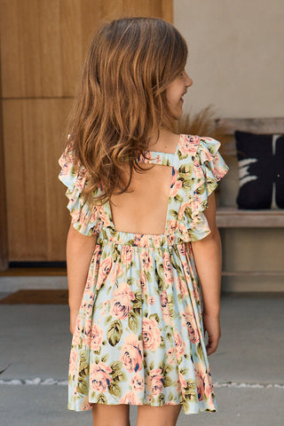 Saltwater Luxe Saltwater Littles Brammie girls mini dress in Capri Blue, lightweight sleeveless dress with floral pattern and ruffle details.