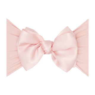 Baby Bling satin FAB headband in rose quartz color, featuring a soft, stretchy fabric with a stylish knot detail for babies.