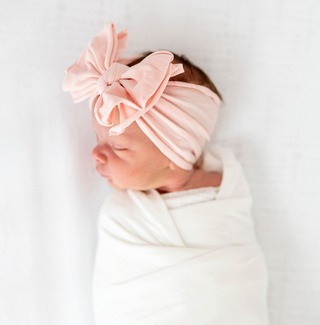 Baby Bling FAB Headband in Rose Quartz with soft fabric and bow detail, perfect for baby girls.