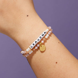 Little Words Project Bracelet - Grandma
Bracelet with 'GRANDMA' on a wrist against a purple background