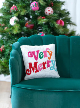 Shiraleah Very Merry Square Pillow
Decorative pillow with 'Very Merry' text on a green couch in front of a Christmas tree.