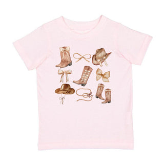 Sweet Wink Cowgirl Cutie Short Sleeve T-Shirt - Ballet
Pink t-shirt with cowboy hats and boots graphic on a white background