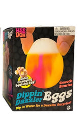Smooth Sunrise
Three boxes of Dippin' Dazzler Eggs with colorful egg-shaped objects on a white background.