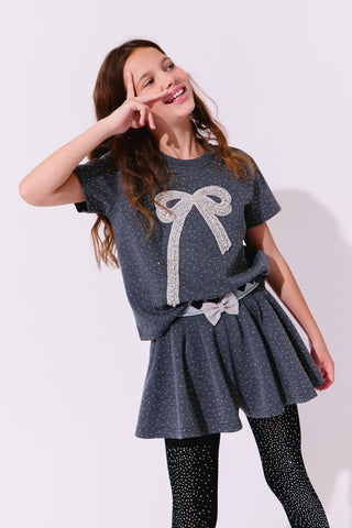 Lola and The Boys Sparkle Bow Charm Skirt Set Girl wearing a gray outfit with a bow design on a white background