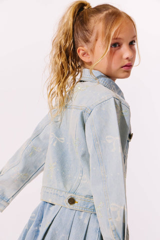 Lola and The Boys Sparkle Bows Denim Jacket
Young girl wearing a light blue denim jacket on a white background