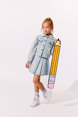 Lola and The Boys Sparkle Bows Denim Pleated Skirt
Child holding a large model of a pencil against a white background