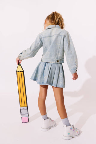 Lola and The Boys Sparkle Bows Denim Pleated Skirt
Child wearing a denim jacket and skirt holding a large pencil-shaped object on a white background