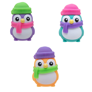 Nee Doh Squishmas Polar Glow PenguinThree colorful penguin toys with hats and scarves on a white background
