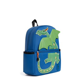 State Bags Kane Backpack - Dragon
A blue children's backpack featuring a large green dragon design on the front, with a black top handle and side pockets, photographed on a clean white background.
